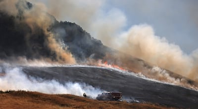 Fire spreads uphill west of Petaluma in California on June 30. AP