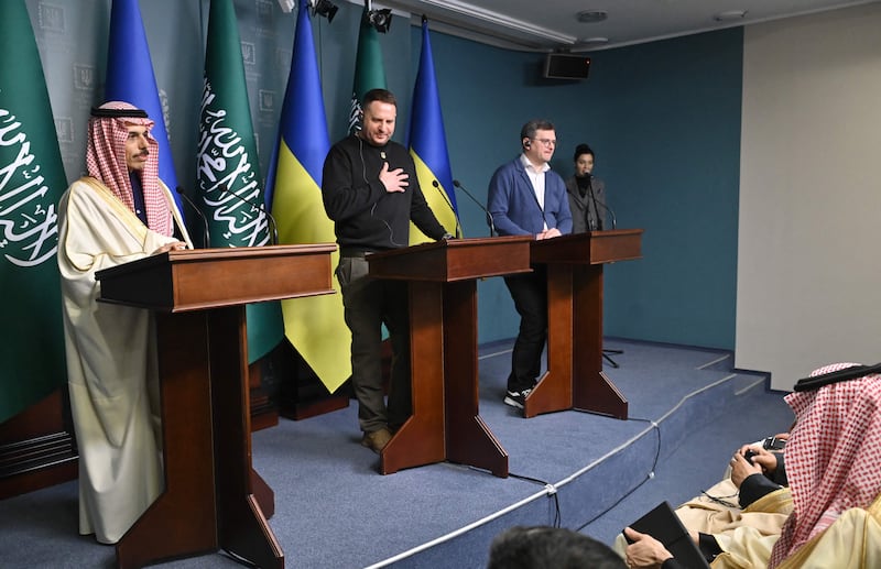 Saudi Foreign Minister Prince Faisal, left, Andriy Yermak, the Head of the Office of the President of Ukraine, centre, and Ukraine's Foreign Minister Dmytro Kuleba, right, at a press conference in Kyiv. AFP