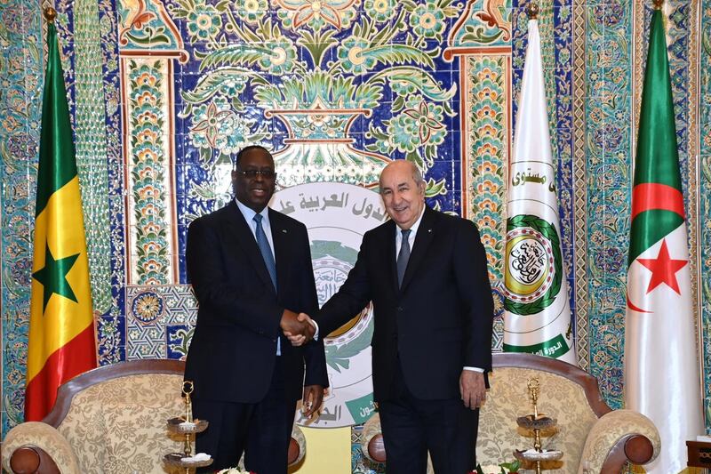 Mr Tebboune, right, greets Macky Sall, African Union President, President of Senegal and guest of honour at the Arab League summit. EPA