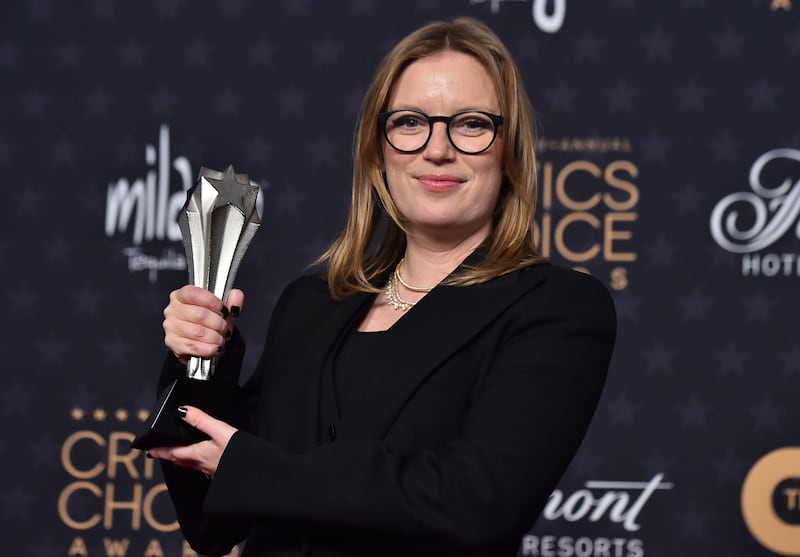 Sarah Polley with the award for Best Adapted Screenplay for Women Talking. AP