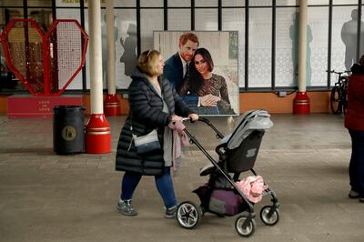 An image made from Lego depicting Prince Harry and Meghan, the Duchess of Sussex, is displayed by the train station in Windsor, England, Tuesday, April 16, 2019. Britain's Prince Harry and Meghan, the Duchess of Sussex, have declared they are keeping the birth of their first child private until they've told family and friends. That has led many to jump to the conclusion that they are planning a home birth at their new residence, Frogmore Cottage, close to Windsor Castle outside of London.(AP Photo/Matt Dunham)