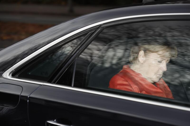 TOPSHOT - German Chancellor Angela Merkel leaves in her car the presidential residence Bellevue Castle in Berlin where she met the German President on November 20, 2017 after coalition talks failed overnight.
Chancellor Angela Merkel was left battling for political survival on November 20 after high-stakes talks to form a new government collapsed, plunging Germany into a crisis that could trigger fresh elections. / AFP PHOTO / Odd ANDERSEN