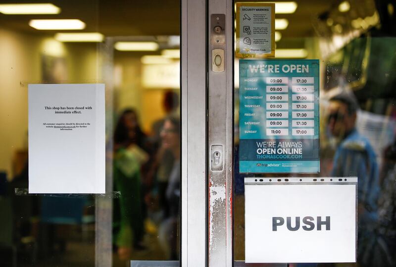 A notice informing people of closure is seen inside the doorway of a Thomas Cook store in London, Britain. Reuters