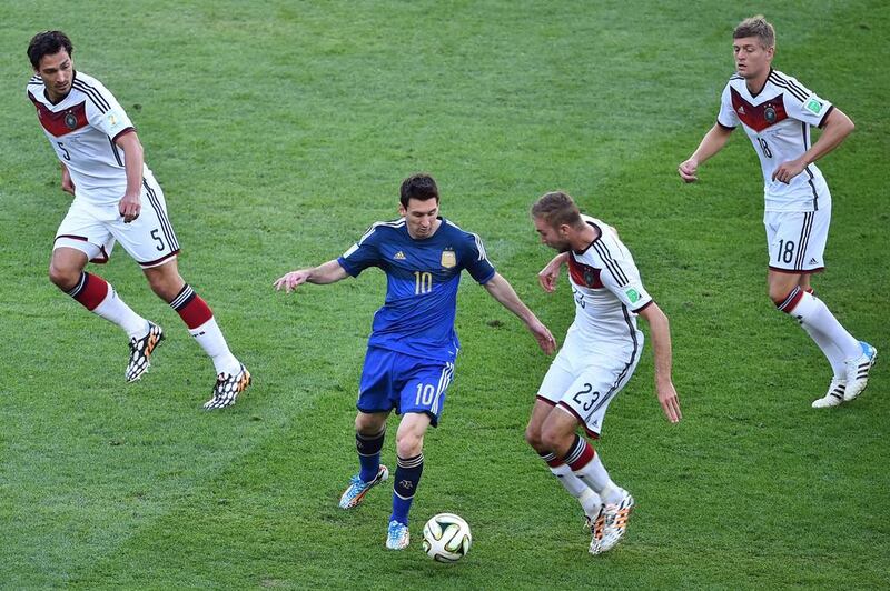 German players surround Lionel Messi, giving him little space to move. Gabriel Bouys / AFP