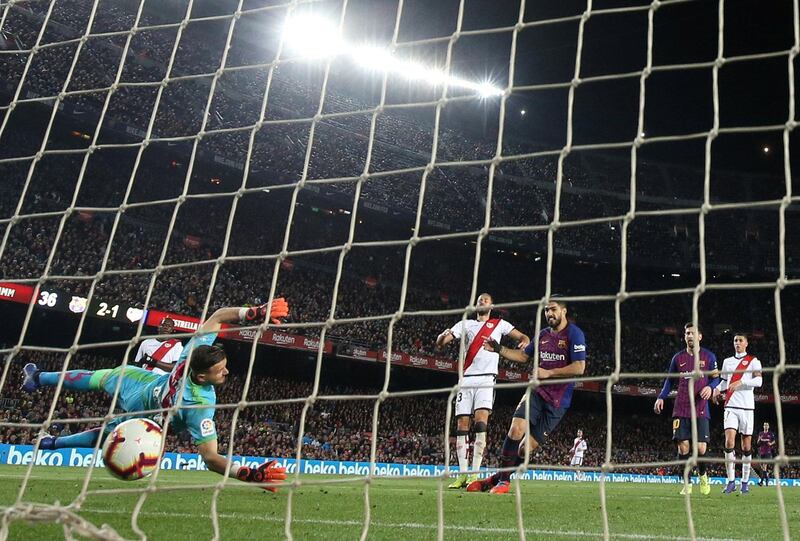 Barcelona's Luis Suarez scores their third goal. Reuters