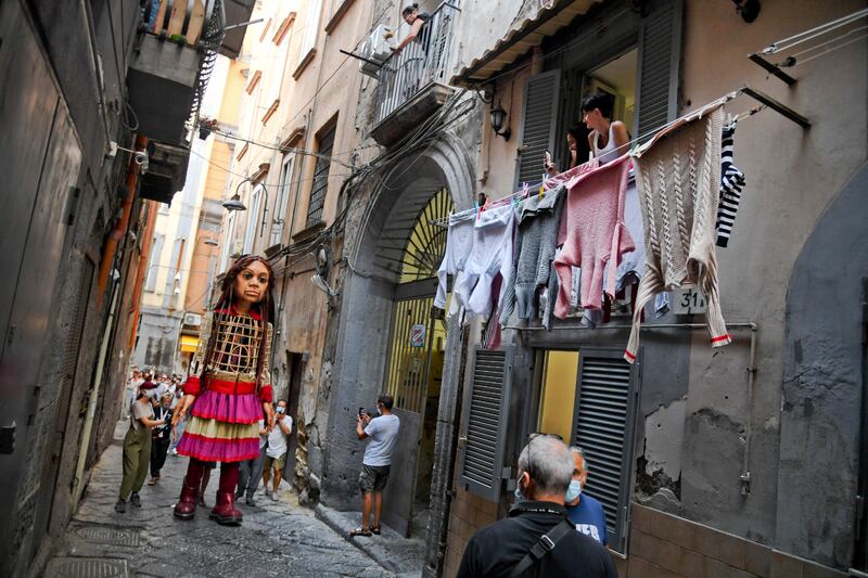 Little Amal arrives in the alleys of the ancient center of Naples, Italy. EPA