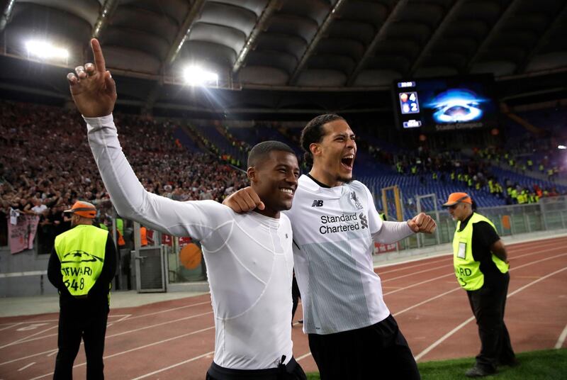 Liverpool's Georginio Wijnaldum, left, and Virgil Van Dijk celebrate at the end of the Champions League semifinal second leg soccer match between Roma and Liverpool at the Olympic Stadium in Rome, Wednesday, May 2, 2018. (AP Photo/Alessandra Tarantino)