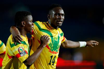 Mali's forward Adama Traore (R) celebrates his second goal during the 2019 Africa Cup of Nations (CAN) football match between Mali and Mauritania at the Suez Stadium in Suez on June 24, 2019.  / AFP / FADEL SENNA
