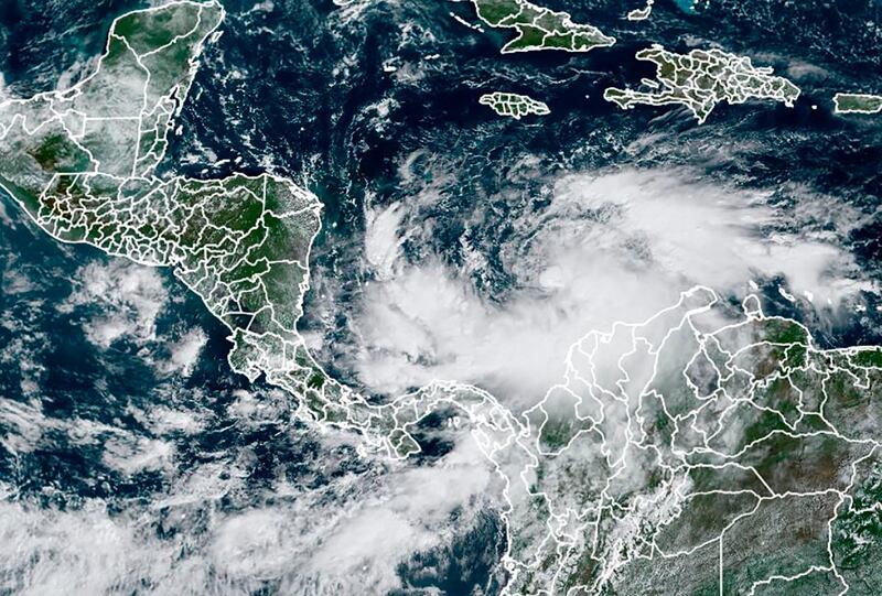 This RAMMB/NOAA satellite image shows Tropical Storm Iota (R) on November 15, 2020, at 14:30 UTC as it approaches Central America. Less than two weeks after powerful storm Eta killed more than 200 people across Central America, authorities warned that Hurricane Iota was set to wallop coastal areas of Nicaragua and Honduras on November 16, 2020. As of 0300 GMT Sunday, Iota -- the latest in an unusually busy storm season -- was about 440 miles (705 kilometers) east-southeast of the Cabo Gracias a Dios on the Nicaragua-Honduras border, moving slowly westwards with maximum sustained winds of 75 miles per hour (120 kph).
 - RESTRICTED TO EDITORIAL USE - MANDATORY CREDIT "AFP PHOTO / RAMMB/NOAA" - NO MARKETING - NO ADVERTISING CAMPAIGNS - DISTRIBUTED AS A SERVICE TO CLIENTS
 / AFP / RAMMB/NOAA/NESDIS / Handout / RESTRICTED TO EDITORIAL USE - MANDATORY CREDIT "AFP PHOTO / RAMMB/NOAA" - NO MARKETING - NO ADVERTISING CAMPAIGNS - DISTRIBUTED AS A SERVICE TO CLIENTS
