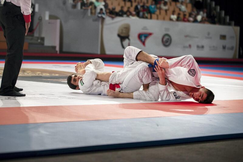 Omar Al Fadhli, left, defeated Darkhan Nortayev of Kazakhstan in the 62kg men’s final at the JJIF World Championship at Mubadala Arena.