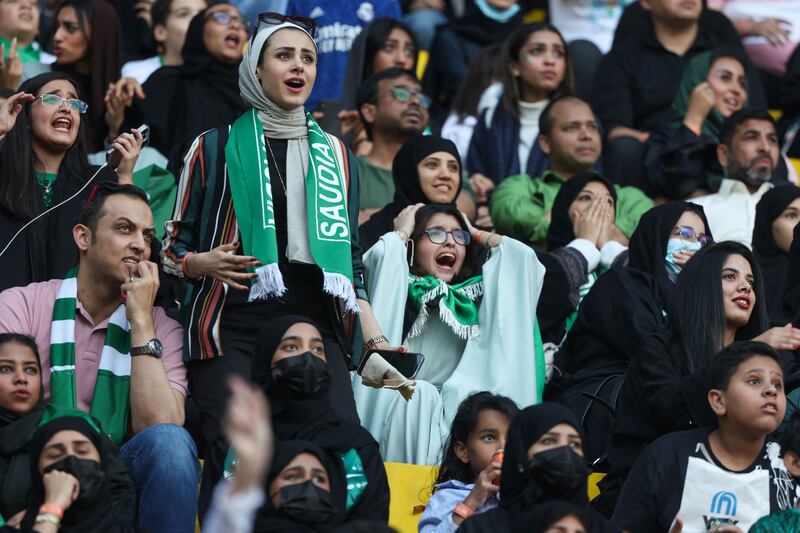 Saudi football fans react as they watch a live broadcast of the Qatar 2022 World Cup Group C football match between Poland and Saudi Arabia, in the capital Riyadh on November 26, 2022.  (Photo by Fayez Nureldine  /  AFP)