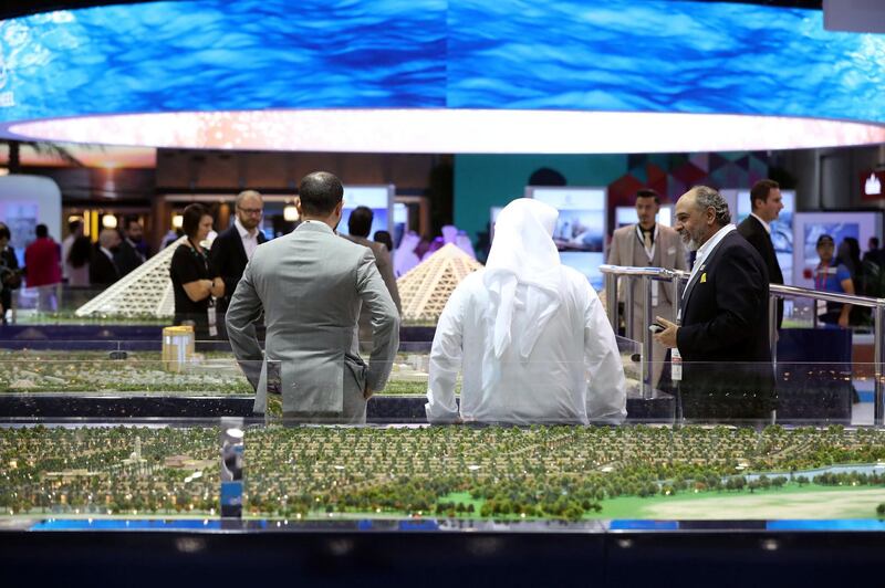 Dubai, United Arab Emirates - October 02, 2018: People at the FalconCity, world in a city model at Cityscape Global 2018. Tuesday, October 2nd, 2018 at World Trade Centre, Dubai. Chris Whiteoak / The National