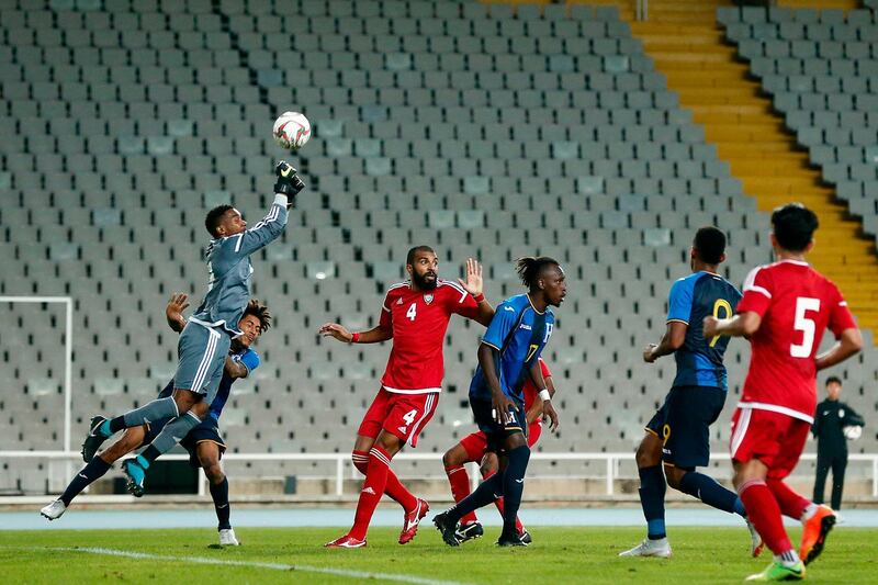 UAE's goalkeeper Khalid Eisa (up) vies with Honduras' defender Henry Figueroa (L) during a friendly football match between United Arab Emirates and  Honduras at the Estadi Olimpic Lluis Companys in Barcelona. AFP