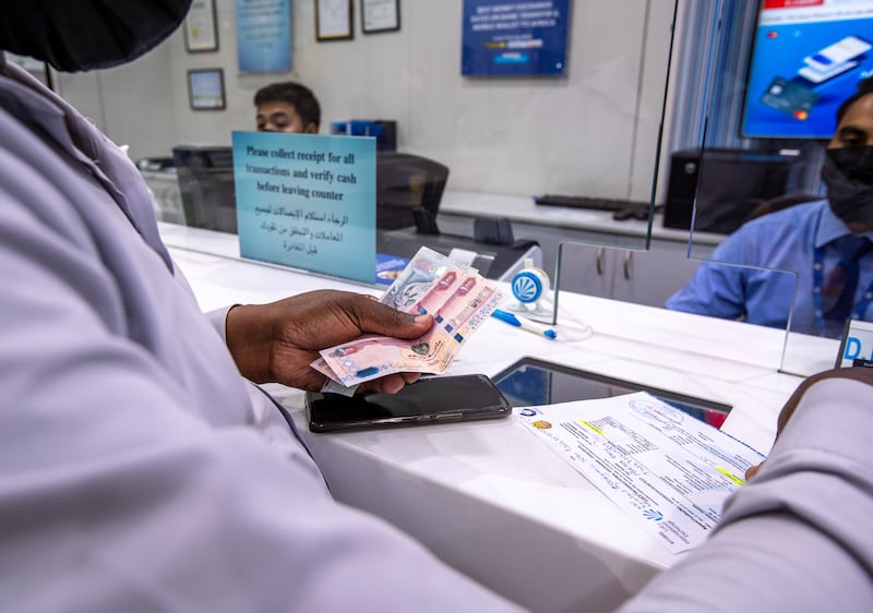 Growth of remittances to poor and middle-income countries is expected to slow to 3.1 per cent in 2024, the World Bank said. Victor Besa / The National