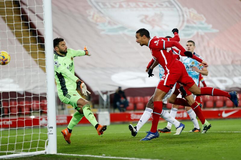 Liverpool's Joel Matip scores his side's third. AP