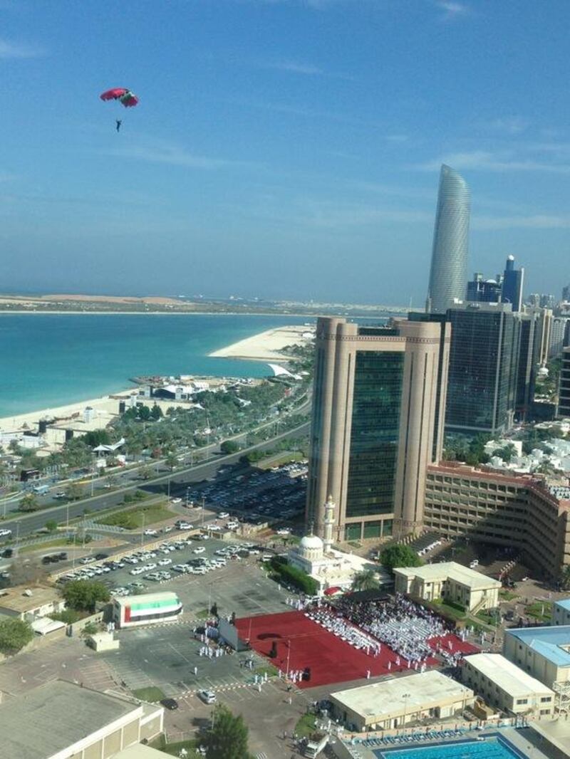 People on Abu Dhabi's Corniche were treated to a spectacle this morning as parachuting daredevils swooped in for a National Day celebration. Kristina Armstrong