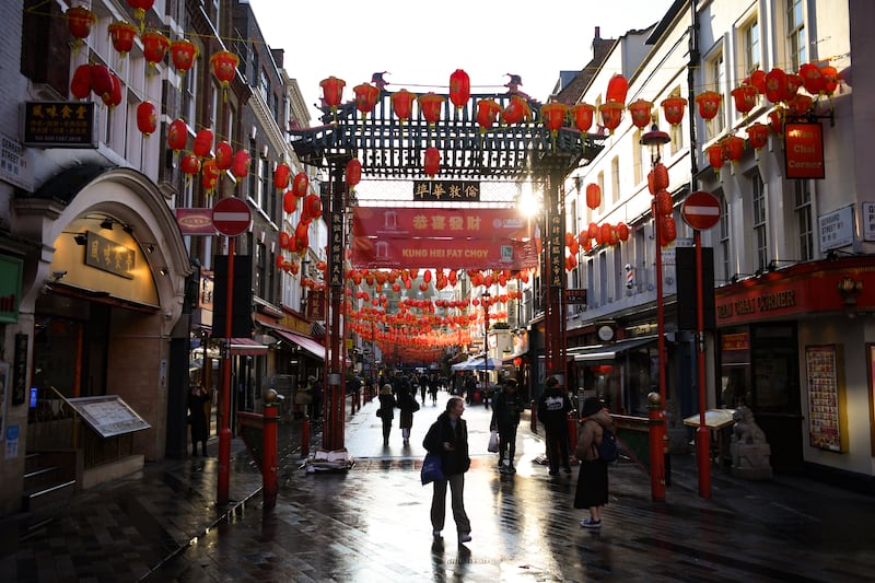 Red lanterns strung across Gerrard St in the centre of London's Chinatown. AFP