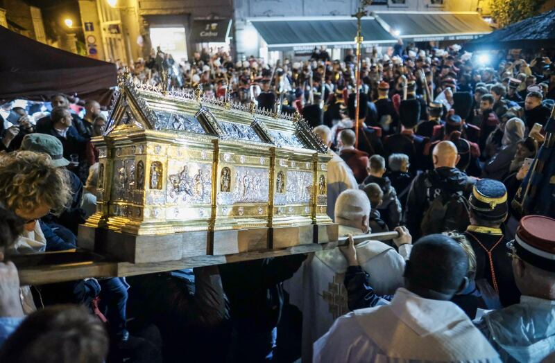 The relics of Sainte Rolende are carried along the route. Olivier Hoslet / EPA