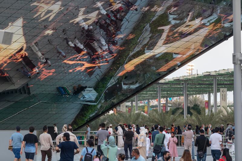 Crowds visit the Saudi Arabia pavilion as the sun sets. Antonie Robertson / The National