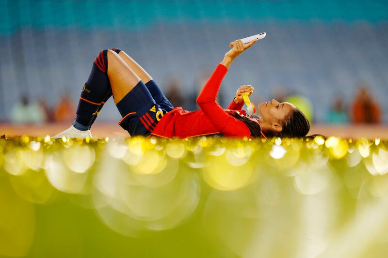 Salma Paralluelo lies on the ground with her medal at the end of the Women's World Cup final between Spain and England. AP