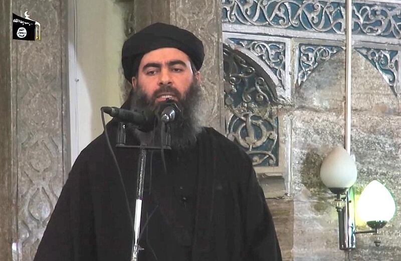 Abu Bakr Al Baghdadi addressing Muslim worshippers at a mosque in the militant-held northern Iraqi city of Mosul. Al Furqan Media / AFP
