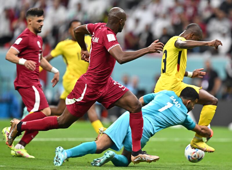 Goalkeeper Saad Al Sheed of Qatar fouls Enner Valencia of Ecuador in the penalty box. EPA
