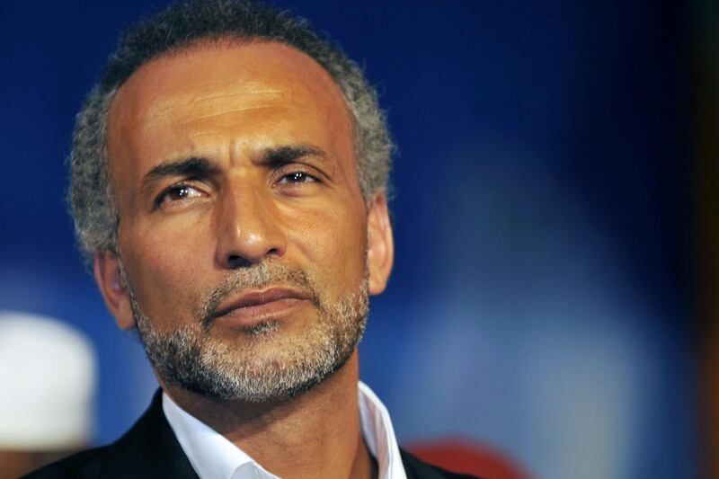 (FILES) This file photo taken on August 27, 2011 shows Islamic scholar Tariq Ramadan looking on at the Treichville sports parc, a popular district of Abijdan, during a conference "Night Destiny (Muslim feast known as Laylat al-Qadr), Night of Peace and Reconciliation". 
Tariq Ramadan denied on November 6, 2017 the allegations of sexual misconduct against teenage girls and announced he will press charges.  Two French women in the past month have filed rape charges against the 55-year-old,  born in Switzerland, while further allegations of sexual misconduct against teenage girls in the 1980s and 1990s have emerged in the Swiss media. / AFP PHOTO / SIA KAMBOU