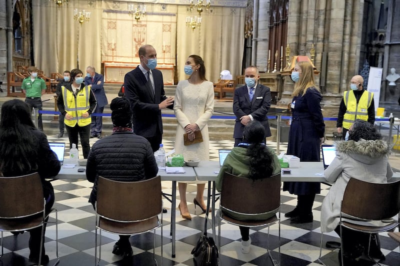 LONDON, ENGLAND - MARCH 23: Prince William, Duke of Cambridge and Catherine, Duchess of Cambridge speak with staff during a visit to the Covid-19 vaccination centre at Westminster Abbey on March 23, 2021 in London, England. (Photo by Aaron Chown - WPA Pool/Getty Images)