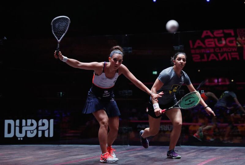 Camille Serme of France competes against Raneem El Weleily of Egypt during Day 3 of the PSA Dubai World Series Finals. Francois Nel / Getty Images for Falcon