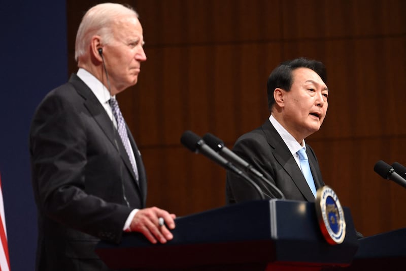US President Joe Biden and South Korean President Yoon Suk-yeol speak to journalists in Seoul, on Saturday.  AFP