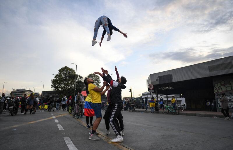 Gymnasts during a protest against President Ivan Duque's government in Bogota. Colombia's government on Thursday invited protest leaders to talks in an attempt to calm tensions after more than a week of deadly demonstrations against Mr Duque. AFP