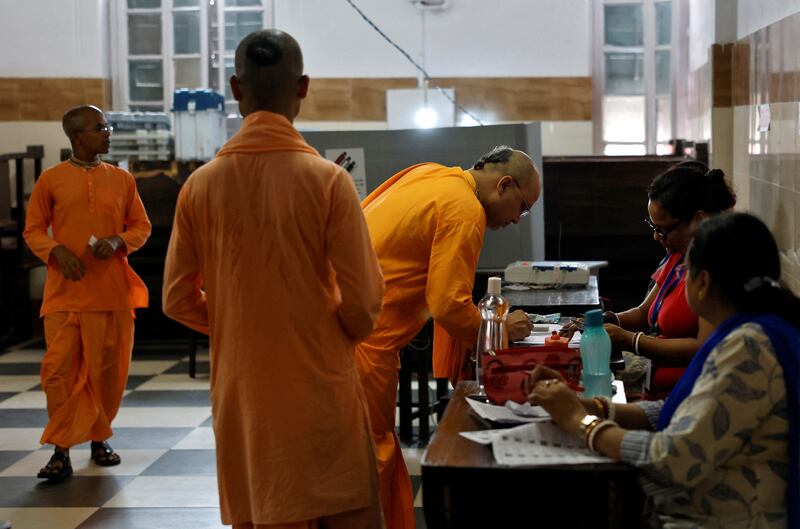 Hindu monks arrive to vote at a polling station in Kolkata. Reuters