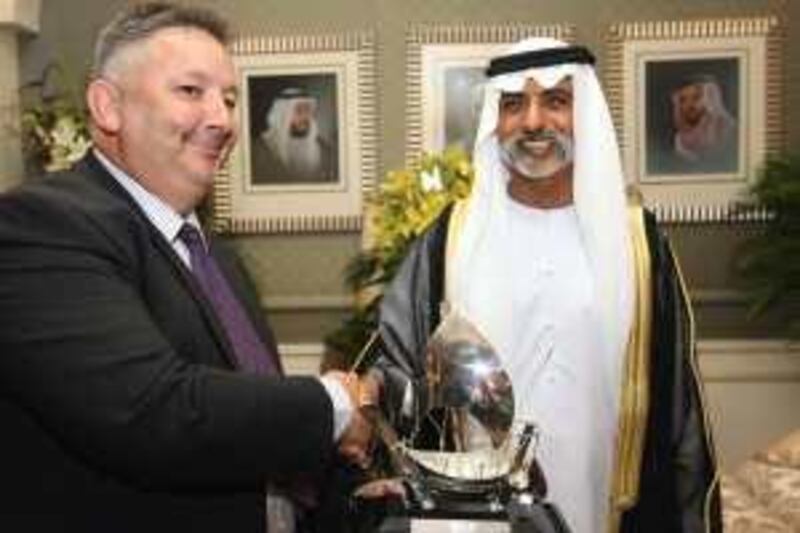 ABU DHABI. 22nd June. 2009 . Sheikh Nahyan bin Mubarak, Minister of Higher Education & Scientific Research , presents the Sheikh Mubarak bin Mohammed Prize for Natural History, named after his father, to Dr.Mark Beech, Head of Division-Cultural Landscapes at the Abu Dhabi Authority Culture & Heritage , at his Majlis in Abu Dhabi.  Stephen Lock  /  The National . Words : Daniel Bardsley.  *** Local Caption ***  SL-prize-001.jpg