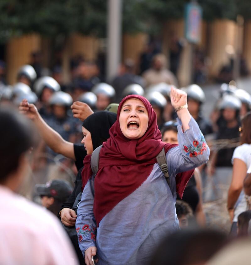 Demonstrators appear outside the Mohammad al-Amin mosque in Beirut's Martyr's Square. AFP