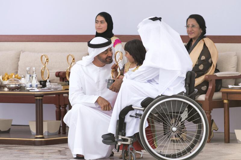 ABU DHABI, UNITED ARAB EMIRATES - March 12, 2018: HH Sheikh Mohamed bin Zayed Al Nahyan, Crown Prince of Abu Dhabi and Deputy Supreme Commander of the UAE Armed Forces (L), presents an Abu Dhabi Award to Theban Salem Al Mheiri (R), during the awards ceremony at the Sea Palace. Seen with Dhabia Thaiban AlMheiri (C).
( Saeed Al Muhairi / Crown Prince Court - Abu Dhabi )
---