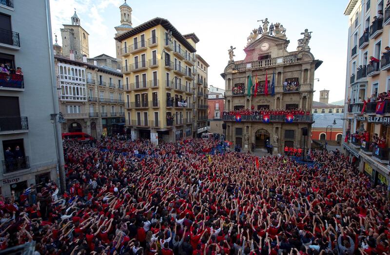 Supporters of football team CA Osasuna celebrate at the city hall in Pamplona, Spain. Osasuna sealed their promotion to Spanish La Liga. EPA