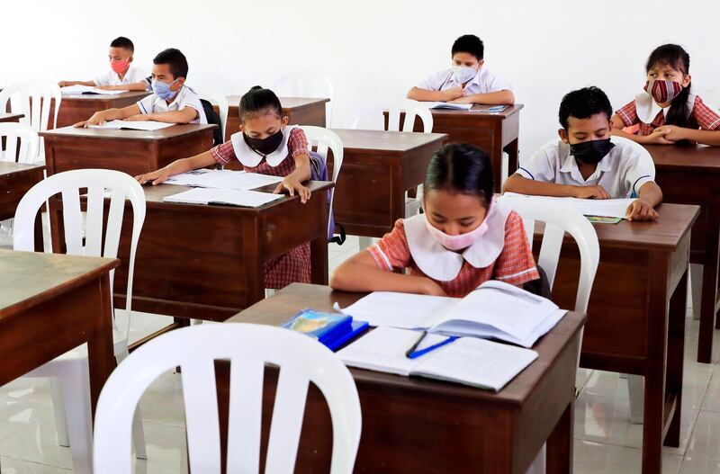epa08515448 Students wearing protective face masks during a class at a reopened school amid an easing of coronavirus restrictions in Dili, Timor Leste, also known as East Timor, 29 June 2020. The government reopened some qualified schools with cover-19 protocol.  EPA/ANTONIO DASIPARU