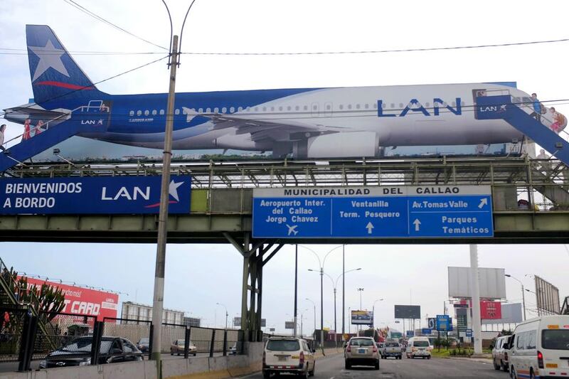 Above, a billboard for LAN Airlines, a member of LatAm Airlines group, near the Jorge Chavez airport in Callao, Peru. Mariana Bazo / Reuters