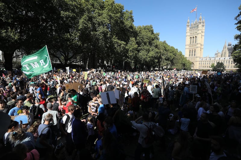 Protesters gather near the Houses of Parliament during the Global Climate Strike demonstration in London, UK. Bloomberg