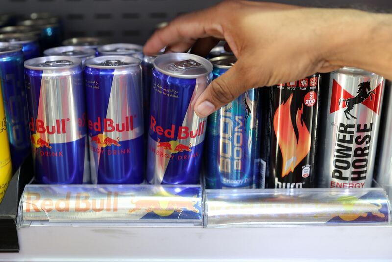 ABU DHABI , UNITED ARAB EMIRATES , OCT 25   – 2017 :- One of the customer picking up the energy drink from the grocery store in Abu Dhabi. (Pawan Singh / The National) 