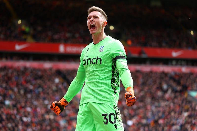 Crystal Palace goalkeeper Dean Henderson celebrates after Eberechi Eze scores their first goal. Reuters