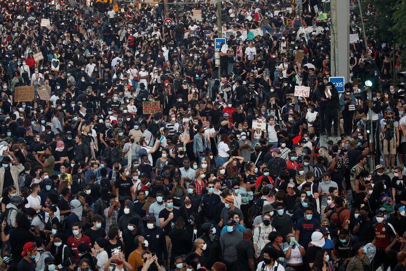 People attend a banned demonstration planned in memory of Adama Traore, a 24-year old black Frenchman who died in a 2016 police operation. Reuters