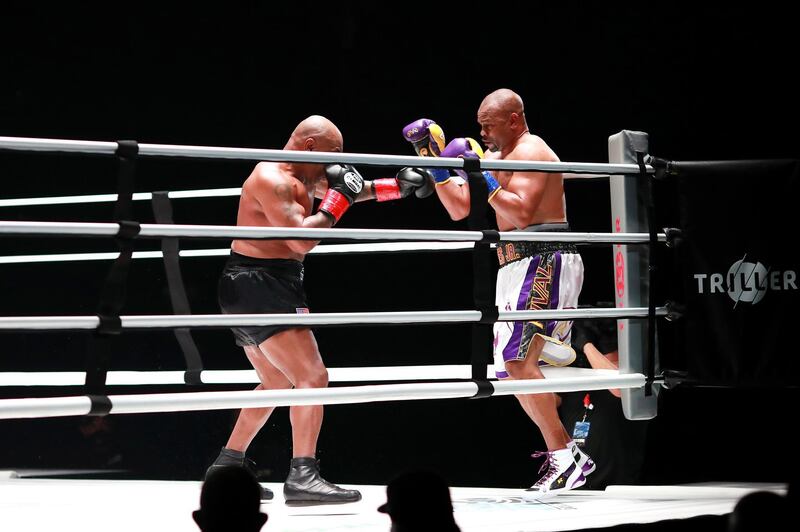 Mike Tyson coners Roy Jones, Jr. during their heavyweight exhibition boxing bout. Reuters