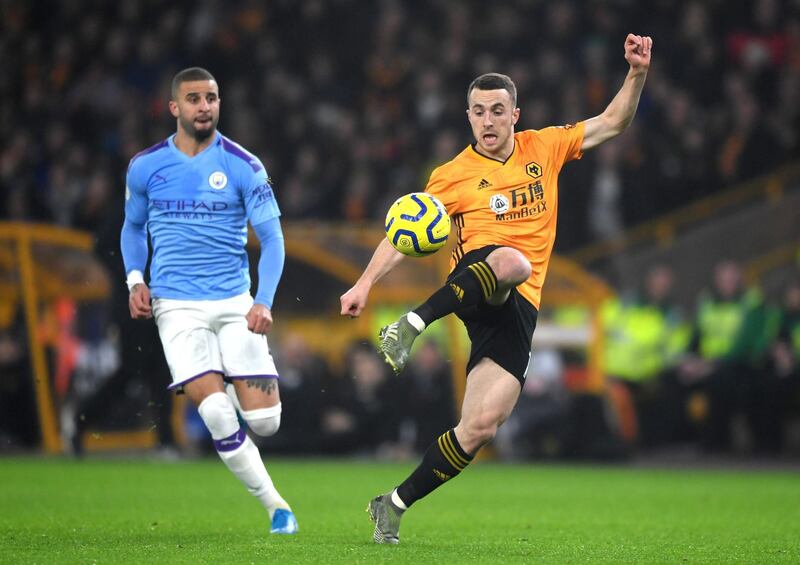 WOLVERHAMPTON, ENGLAND - DECEMBER 27: Diogo Jota of Wolverhampton Wanderers controls the ball in front of Kyle Walker of Manchester City  during the Premier League match between Wolverhampton Wanderers and Manchester City at Molineux on December 27, 2019 in Wolverhampton, United Kingdom. (Photo by Shaun Botterill/Getty Images)