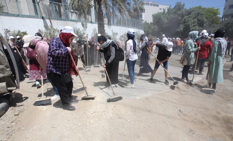 Volunteers clean Gaza's streets as part of the Han'amerha (we will rebuild it) campaign. All photos by WAFA