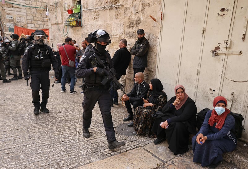 Israel's Foreign Ministry tweeted video purportedly showing masked Palestinians throwing objects inside the mosque. AFP