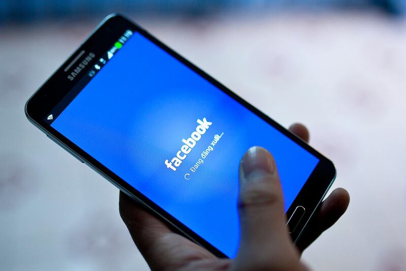 epa07054950 (FILE) - A file picture dated 28 November 2013 shows a person using Facebook on his phone at a cafe in Hanoi, Vietnam (reissued on 28 September 2018). Facebook has announced on 28 September 2018 that a previously unreported attack on its network exposed the personal data of nearly 50 million users. According to the Social network, the breach was discovered earlier this week, adding that the vulnerability has been fixed and law enforcement has been notified.  EPA/LUONG THAI LINH *** Local Caption *** 53101411