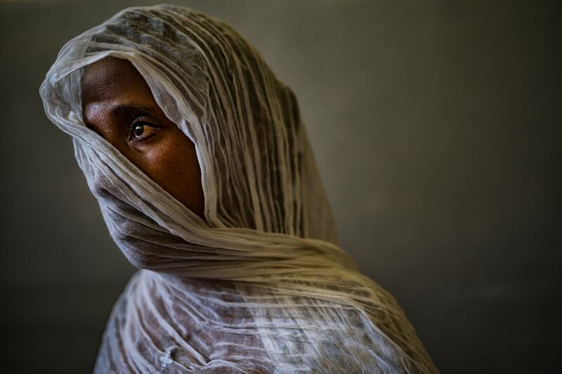 Eyerus, 40, poses for a portrait in a safe space for victims of sexual assault in the Ayder Hospital in Mekelle, Tigray, northern Ethiopia, in May 2021.