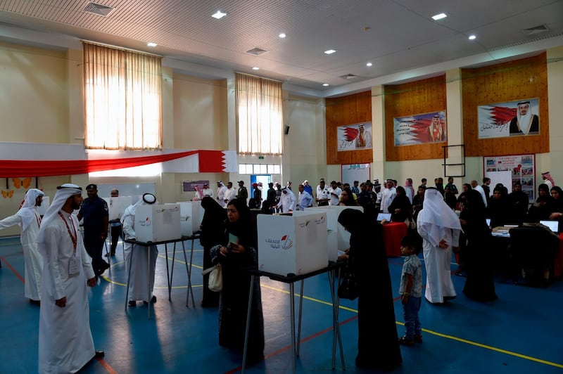 Bahraini voters cast their ballots. AFP
