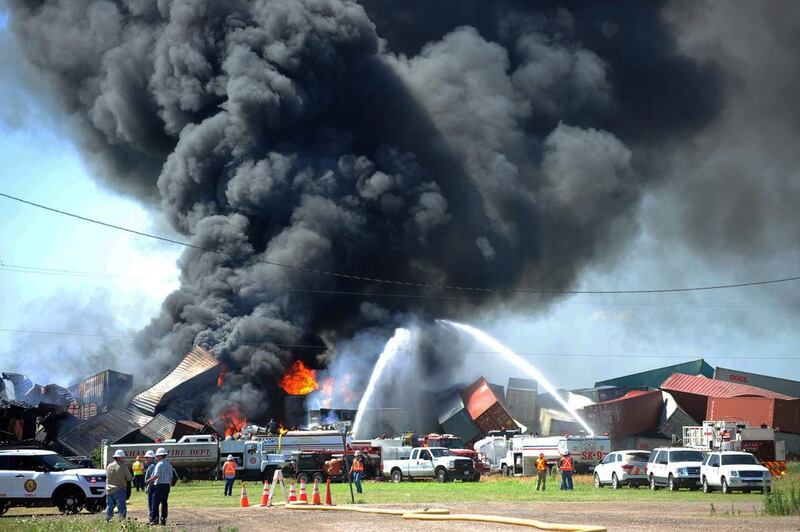 Three crew members were missing and one was hurt on June 28, 2016, after a head-on train collision in Panhandle, Texas. Several box cars erupted in flames and led authorities to evacuate residents in the area. The fire was still burning several hours later. Sean Steffen / Amarillo Globe-News via A